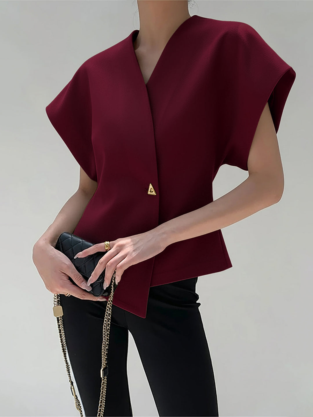 Damska Bluzka Bez Rękawów z Dekoltem V i Zapięciem na Guziki z Przodu