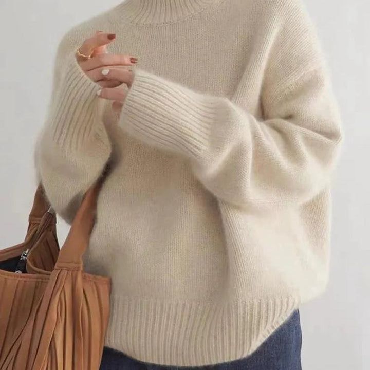 Damski sweter oversize z golfem i dzianinową powierzchnią